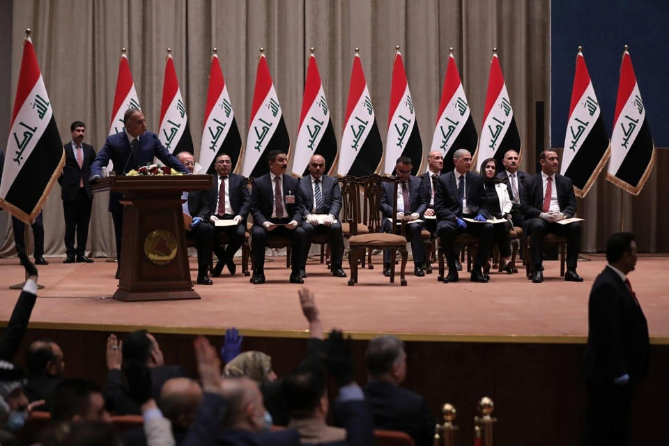 Mustafa al-Kahdimi, Iraqi Prime Minister-designate speaks to members of the Iraqi parliament in Baghdad, Iraq, Thursday, May 7, 2020. Iraq's former spy chief was sworn in early Thursday as the prime minister by lawmakers after weeks of tense political negotiations as the country faces a severe economic crisis spurred by the coronavirus pandemic. The parliament approved the government of al-Kahdimi after long wrangling over his proposed Cabinet. (Iraqi Parliament Media Office, via AP)