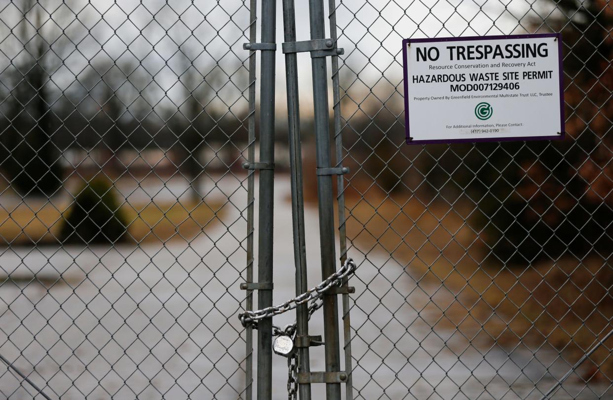 A locked gate and no trespassing sign at a drive into the the old Kerr-McGee railroad tie plant on West High Street on Wednesday, Feb. 22, 2023. 
