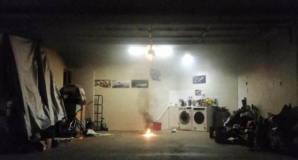 The garage filled with smoke and flames on the floor.