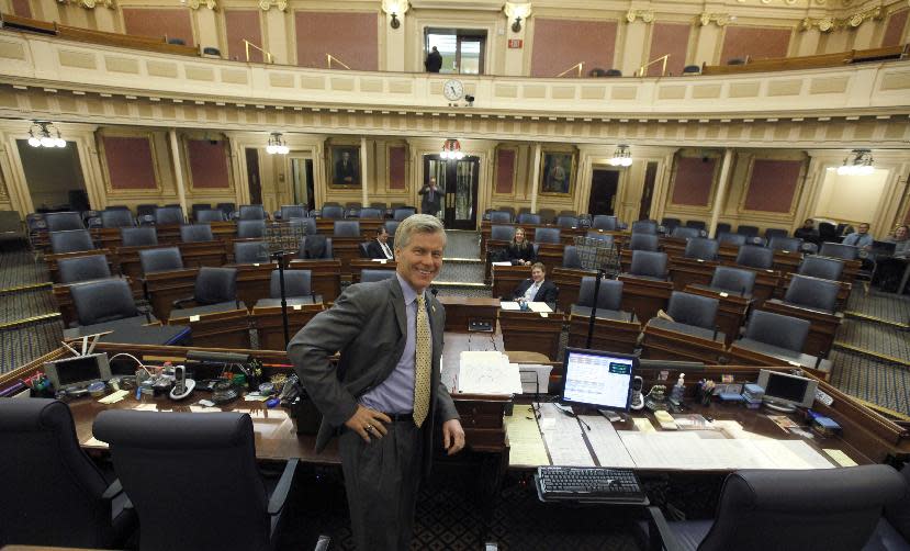 Virginia Governor Bob McDonnell relaxes for a moment in the near-empty House of Delegates chamber before rehearsing his last State of the Commonwealth speech at the State Capitol in Richmond, Va. Tuesday, Jan. 7, 2014. He will deliver the speech live at 7 PM on Wednesday to a joint session of the Legislature.(AP Photo/Richmond Times-Dispatch, Bob Brown).