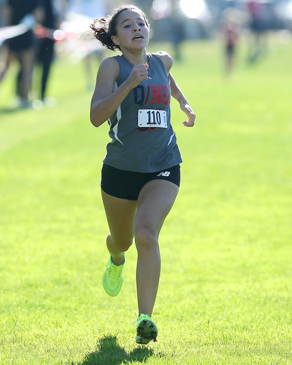 Quincy/ North Quincy’s Salma Boukhtam finishes strong to take second overall with a time of 18:32.54 during the Patriot League Championship Meet at Hingham High School on Saturday, Oct. 28, 2023. Plymouth South boys would win with 48 points while Marshfield girls would win with 24 points.