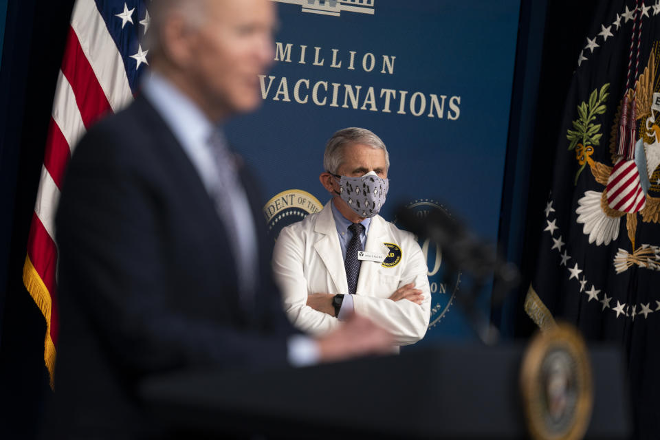 Director of the National Institute of Allergy and Infectious Diseases Dr. Anthony Fauci listens as President Joe Biden speaks during an event to commemorate the 50 millionth COVID-19 shot, in the South Court Auditorium on the White House campus, Thursday, Feb. 25, 2021, in Washington. (AP Photo/Evan Vucci)