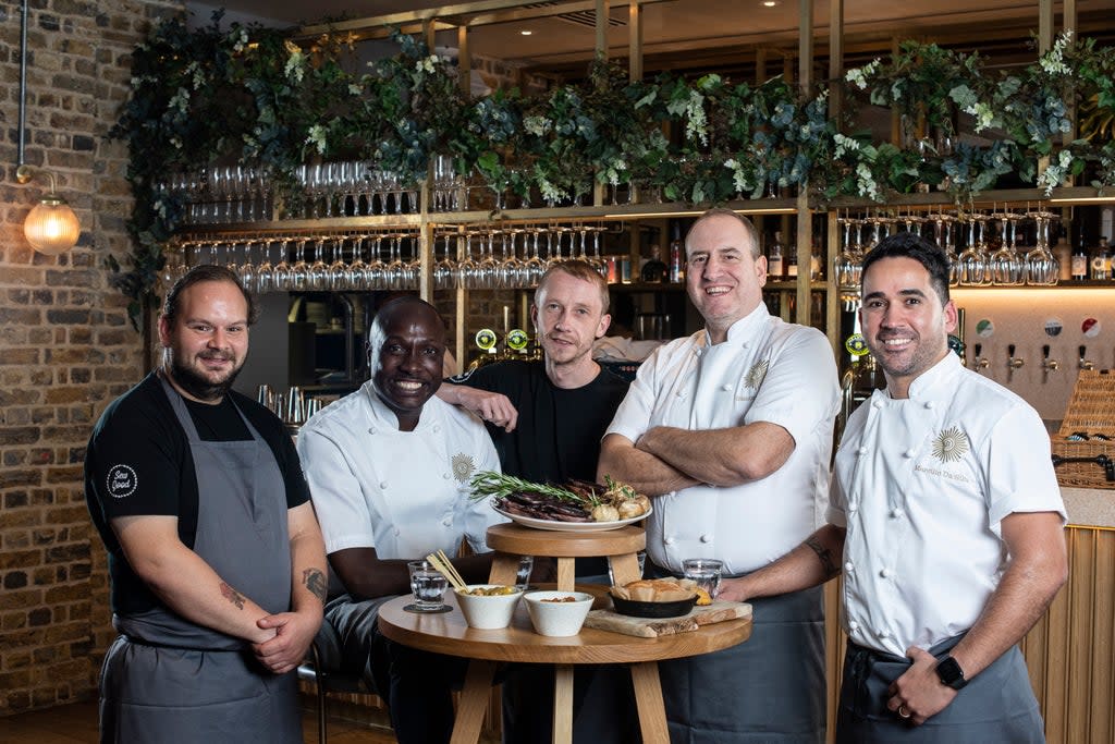 Service with a purpose: head chef Marcilio da Silva, far right, leads the Brigade restaurant founded by Simon Boyle, second from right. Pictured with their apprentices, the pair help at-risk people to transform their lives (Daniel Hambury/Stella Pictures Ltd)