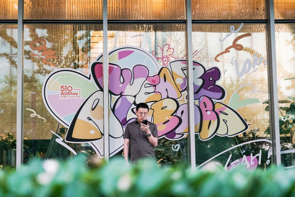 BEIJING, CHINA - JULY 14: A man stands in front of the Alibaba Group Holdings office on July 14, 2022 in Beijing, China.  (Photo provided by Kuang Da/JIEMIAN NEWS/VCG, Getty Images)