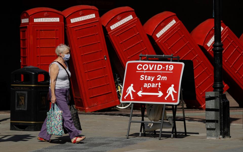 Social distancing restrictions should no longer be part of the UK picture after June, the letter says - Matt Dunham/ AP