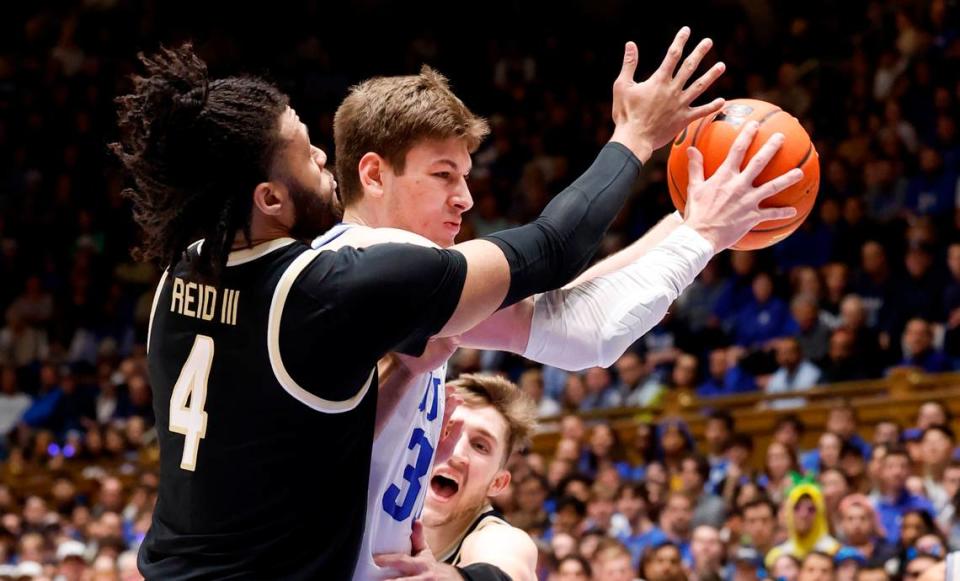 Duke’s Kyle Filipowski (30) drives past Wake Forest’s Efton Reid III (4) during the first half of Duke’s game against Wake Forest at Cameron Indoor Stadium in Durham, N.C., Monday, Feb. 12, 2024. Ethan Hyman/ehyman@newsobserver.com