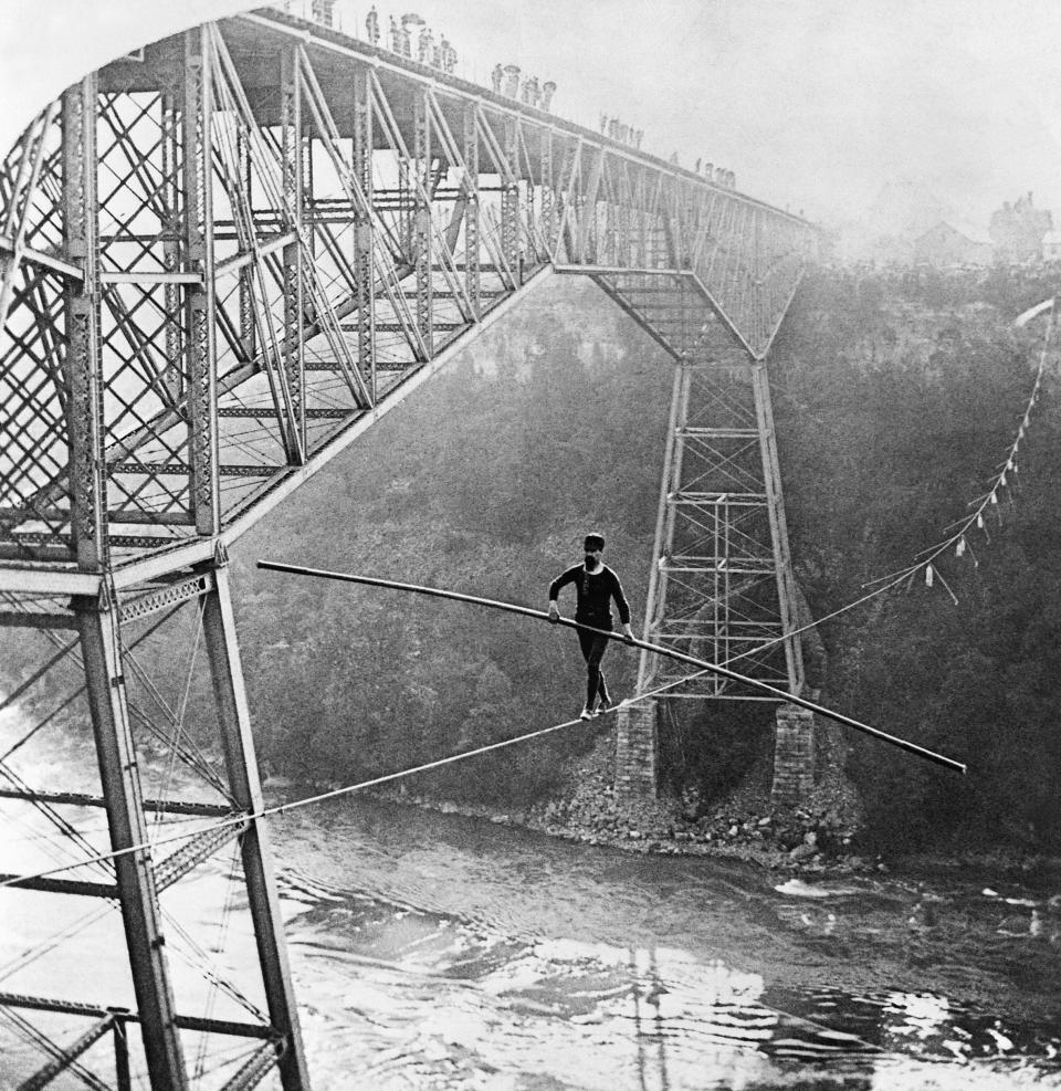 Samuel Dixon walks across the Niagara River Gorge in 1890.