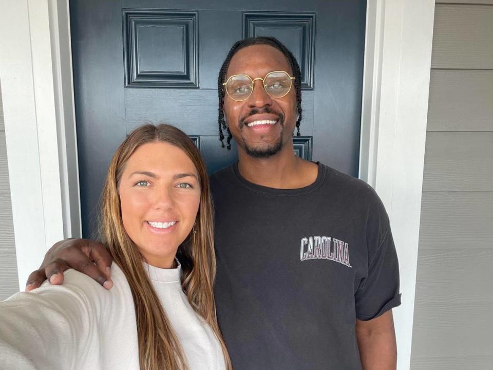 Sarah and Ryan Barkley take a selfie in front of the home they recently moved into in Fort Mill, largely due to the schools and small-town feel.