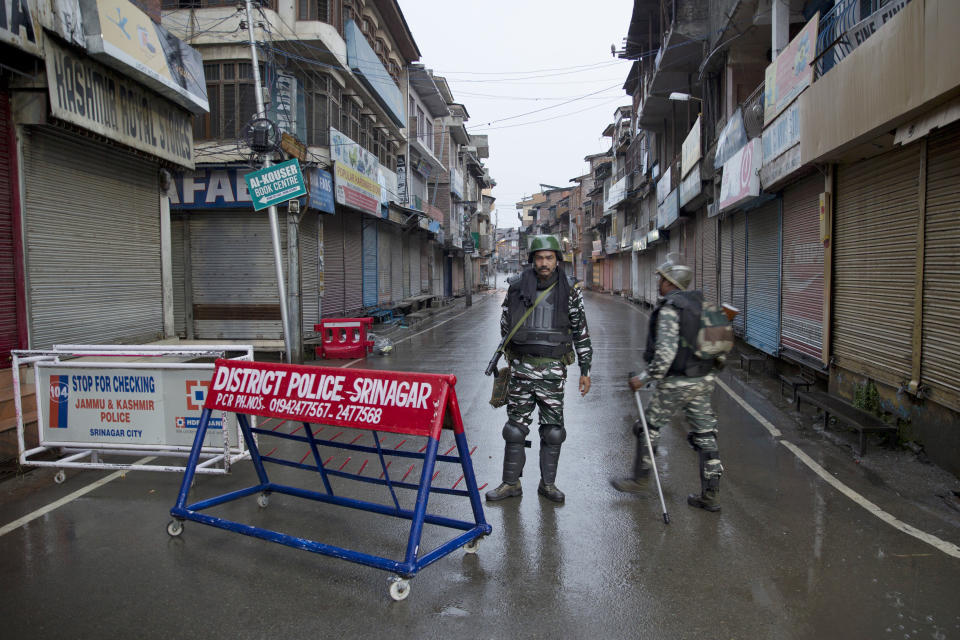 Indian paramilitary soldiers stand guard during security lockdown in Srinagar, Indian controlled Kashmir, Wednesday, Aug. 14, 2019. India has maintained an unprecedented security lockdown to try to stave off a violent reaction to Kashmir's downgraded status. Protests and clashes have occurred daily, thought the curfew and communications blackout have meant the reaction is largely subdued. (AP Photo/ Dar Yasin)