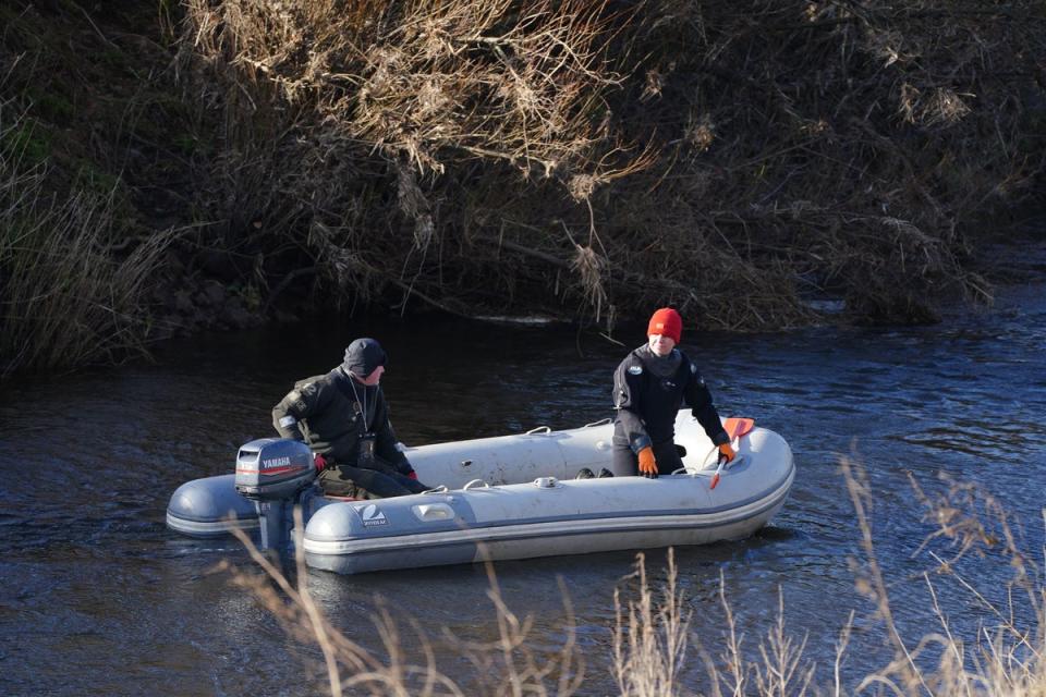 Specialist search teams scouring the river (PA)