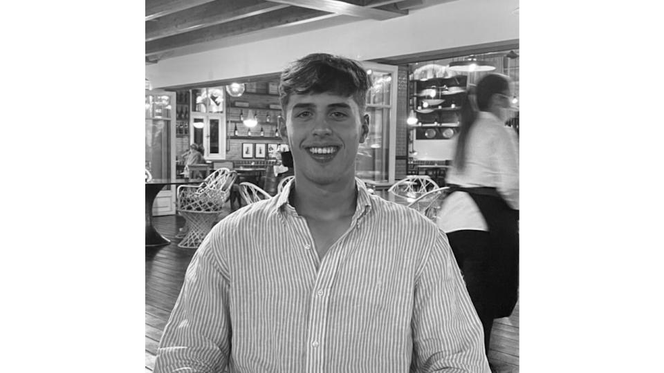 Black-and-white photo of Flynn Southgate at a restaurant table