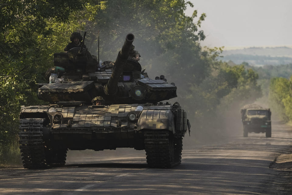 A Ukrainian tank drives in Donetsk region, eastern Ukraine, Thursday, June 9, 2022. (AP Photo/Bernat Armangue)