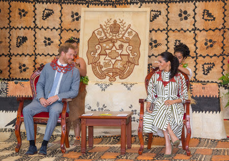 Britain's Meghan, Duchess of Sussex and Prince Harry, Duke of Sussex are given flower garlands at the Fa'onelua Convention Centre on the second day of the royal couple's visit to Tonga, October 26, 2018. Dominic Lipinski/Pool via REUTERS