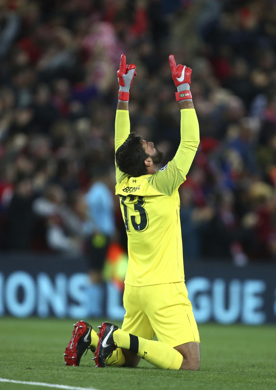 Liverpool's goalkeeper Alisson Becker celebrates as his side score their second goal during the Champions League Group C soccer match between Liverpool and Paris-Saint-Germain at Anfield stadium in Liverpool, England, Tuesday, Sept. 18, 2018. (AP Photo/Dave Thompson)