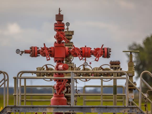A red natural gas wellhead.