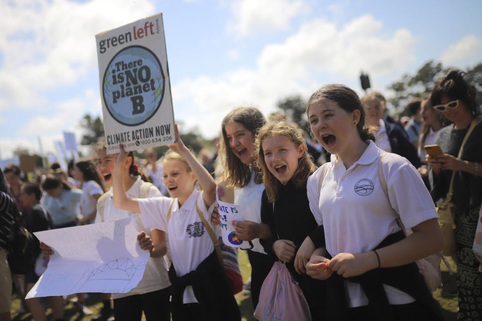 Protesters with placards participate in the Global Strike 4 Climate rally in Sydney, Friday, Sept. 20, 2019. Thousands of protesters are gathering at rallies around Australia as a day of worldwide demonstrations begins ahead of a U.N. climate summit in New York. (Steven Saphore/AAP Images via AP)