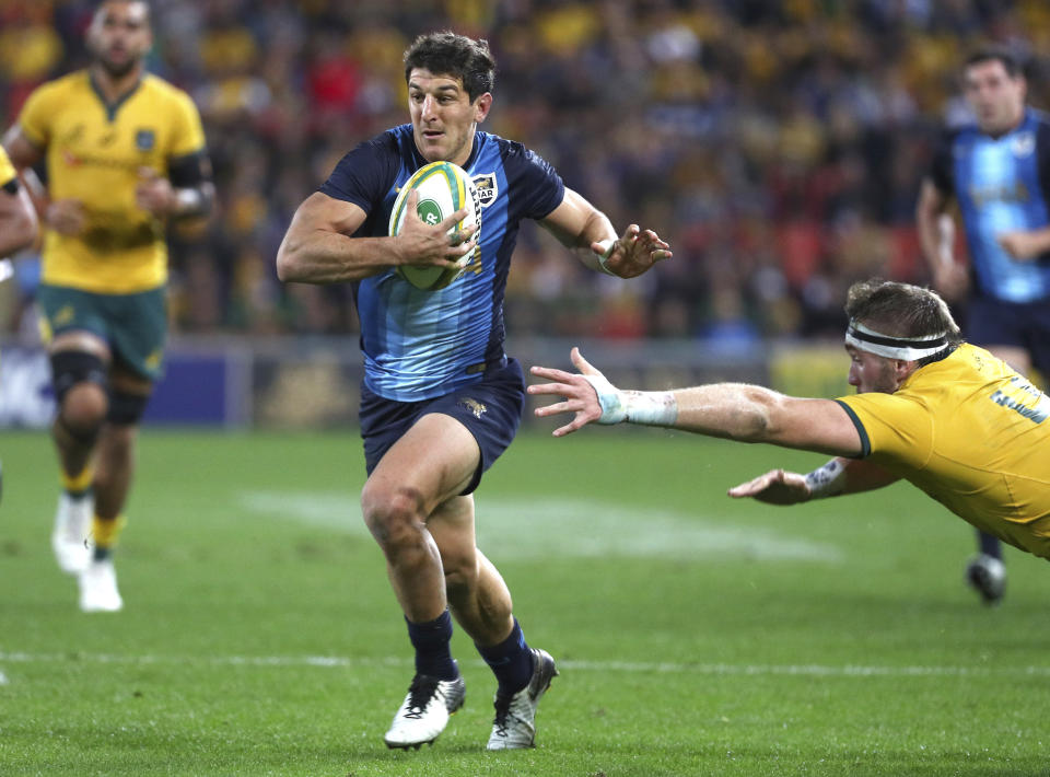 Argentina's Tomas Cubelli attacks during the Rugby Championship match between Australia and Argentina in Brisbane, Australia, Saturday July 27, 2019. (AP Photo/Tertius Pickard)