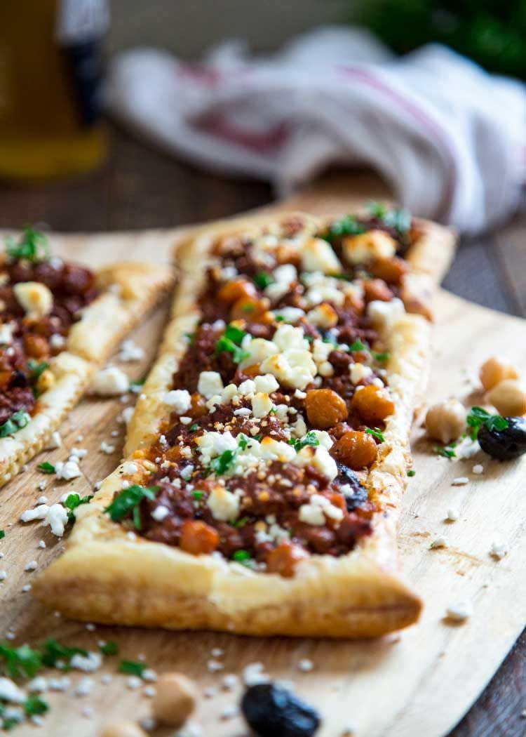 <p>It doesn't get prettier than this. This is one of those meals that comes together in 30 minutes, and the result is pretty darn amazing.</p><p>Get the <a href="https://keviniscooking.com/greek-lamb-chickpea-and-feta-tart/" rel="nofollow noopener" target="_blank" data-ylk="slk:Greek Lamb Feta Tart;elm:context_link;itc:0;sec:content-canvas" class="link ">Greek Lamb Feta Tart</a> recipe.</p><p>Recipe from <a href="https://keviniscooking.com/" rel="nofollow noopener" target="_blank" data-ylk="slk:Kevin Is Cooking;elm:context_link;itc:0;sec:content-canvas" class="link ">Kevin Is Cooking</a>.</p>