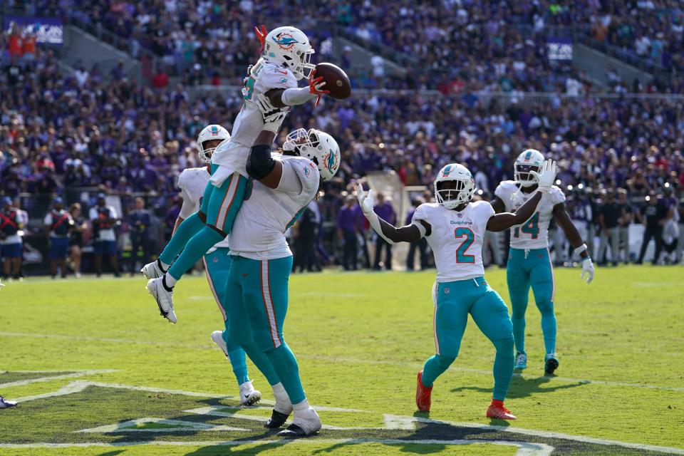 Sep 18, 2022; Baltimore, Maryland, USA; Miami Dolphins wide receiver Jaylen Waddle (17) greeted by teammates following his game-winning touchdown catch in the fourth quarter against the Baltimore Ravens at M&T Bank Stadium. Mandatory Credit: Mitch Stringer-USA TODAY Sports