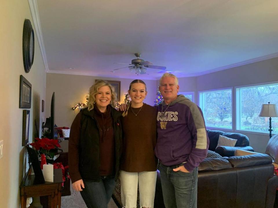 The Turner family has done Christmas light displays in the Tri-Cities area for more than a decade. This year, Danielle (left) and Ron (right) let their youngest daughter Tiffany (center) lead the project.