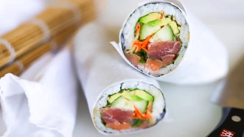 Close-up of a cut salmon tuna sushi burrito