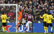 Chelsea's goalkeeper Edouard Mendy, centre, makes a save during the English Premier League soccer match between West Ham United and Chelsea at the London stadium in London, Saturday, Dec. 4, 2021. (AP Photo/Alastair Grant)