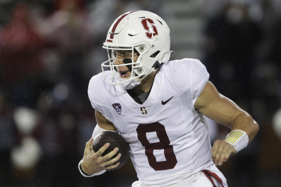 Stanford quarterback Justin Lamson carries the ball during the first half of the team's NCAA college football game against Washington State, Saturday, Nov. 4, 2023, in Pullman, Wash. (AP Photo/Young Kwak)