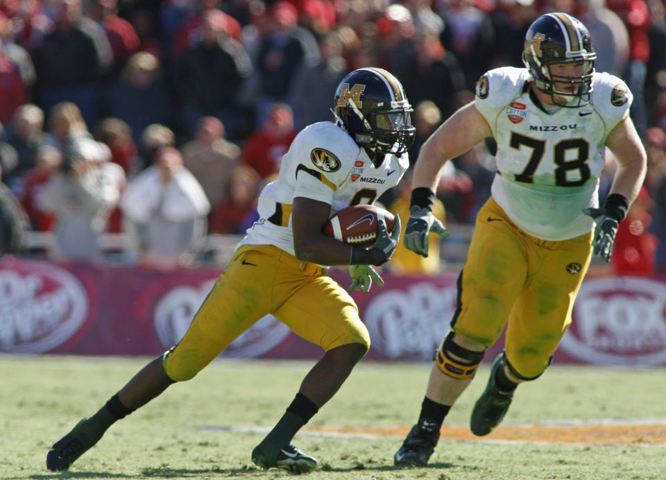 Missouri wide receiver Jeremy Maclin (9) cuts back as offensive lineman Kurtis Gregory (78) provides blocking against Arkansas in the third quarter. Missouri defeated Arkansas 38-7, during the AT&T Cotton Bowl in Dallas, Texas, on Tuesday, January 1, 2008.  (Photo by Darrell Byers/Fort Worth Star-Telegram/Tribune News Service via Getty Images)