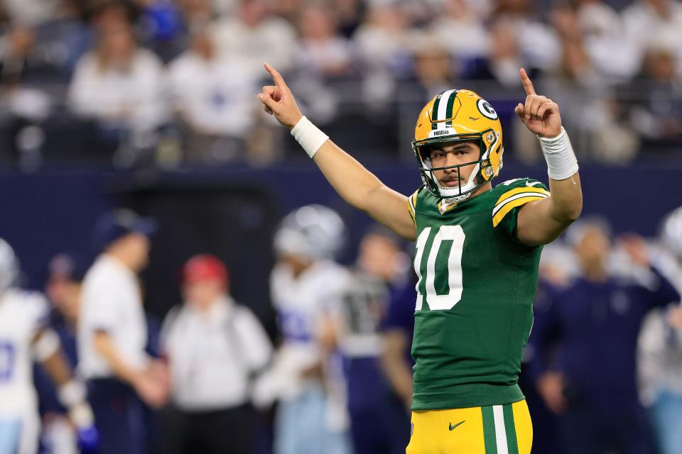 Jordan Love #10 of the Green Bay Packers celebrates a touchdown against the Dallas Cowboys during the third quarter of the NFC Wild Card Playoff game at AT&T Stadium on January 14, 2024 in Arlington, Texas.