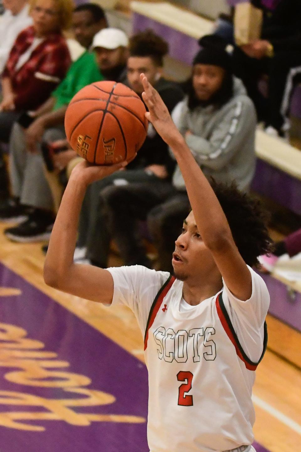 Highland Park senior Jahmir Kingcannon (2) shoots for three against Shawnee Mission North.