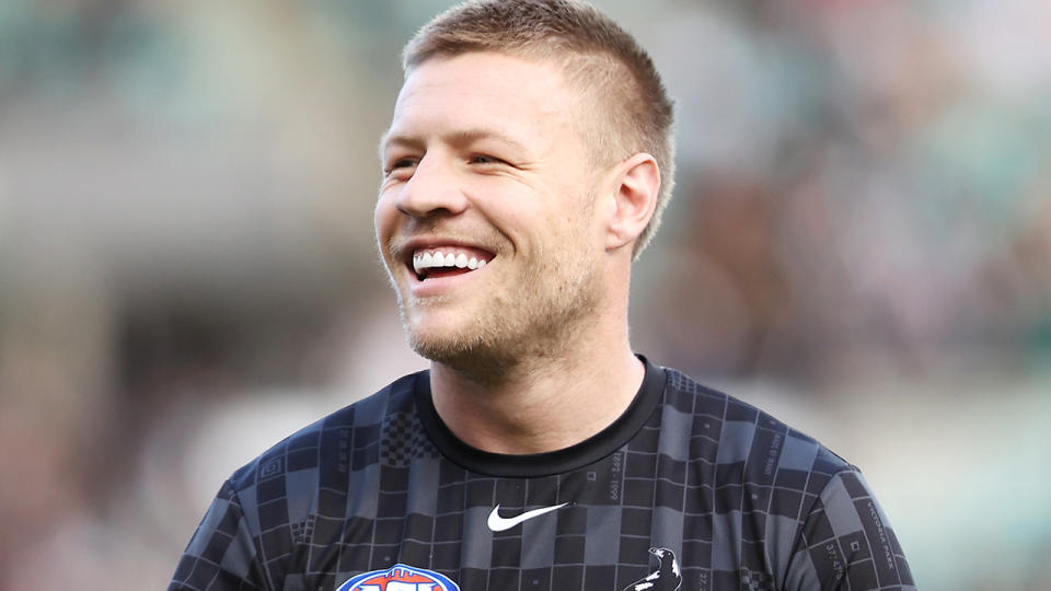 Jordan De Goey is pictured warming up for Collingwood ahead of an AFL match.