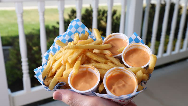 Ron Taylor holds Arctic Circle fries and fry sauce at his home in Orem on Thursday, June 16, 2022.