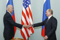 FILE - In this March 10, 2011, file photo, Vice President Joe Biden, left, shakes hands with Russian Prime Minister Vladimir Putin in Moscow, Russia. Central and Eastern European nations are anxious about the Wednesday, June 16, 2021, summit meeting between now U.S. President Biden and Putin, wary of what they see as hostile intentions from the Kremlin. (AP Photo/Alexander Zemlianichenko, File)