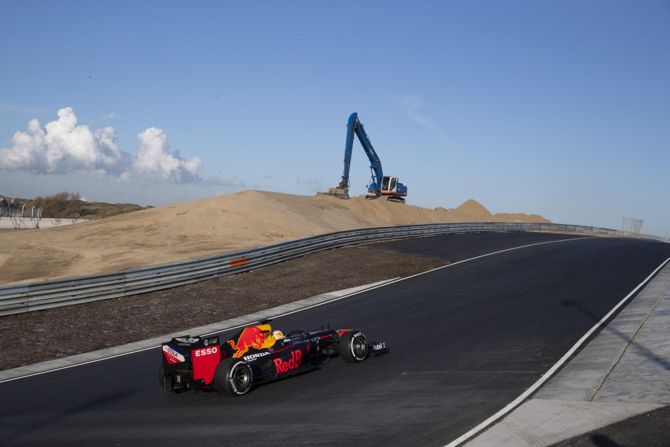 F1 driver Max Verstappen of The Netherlands drives his car through one of the two banked corners during a test and official presentation of the renovated F1 track in the beachside resort of Zandvoort, western Netherlands, Wednesday, March 4, 2020. (AP Photo/Peter Dejong)