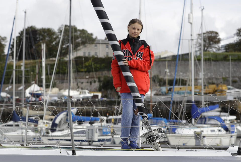 Greta Thunberg poses for a picture on the boat Malizia as it is moored in Plymouth, England Tuesday, Aug. 13, 2019. Greta Thunberg, the 16-year-old climate change activist who has inspired student protests around the world, is heading to the United States this week - in a sailboat. (AP Photo/Kirsty Wigglesworth)