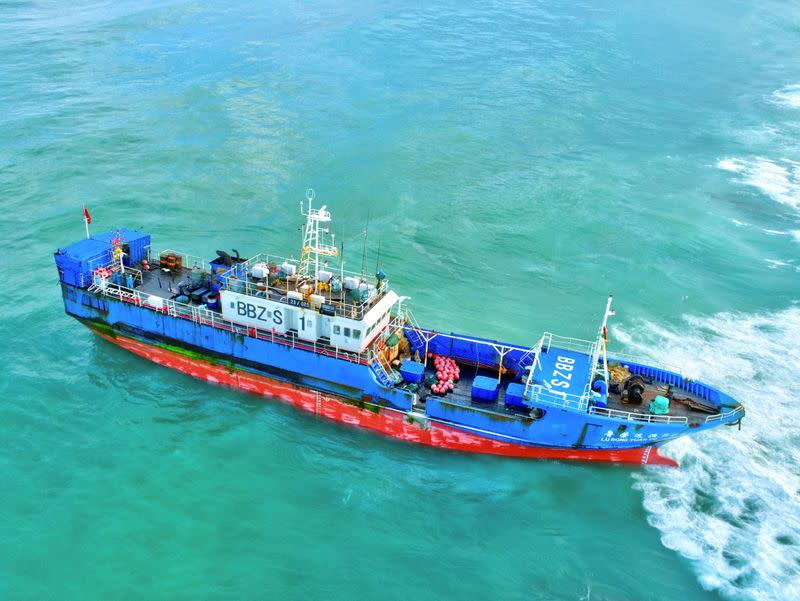 A Chinese-flagged trawler that ran aground containing 130 tonnes of oil, is seen in the Indian Ocean waters at Pointe Aux Sable