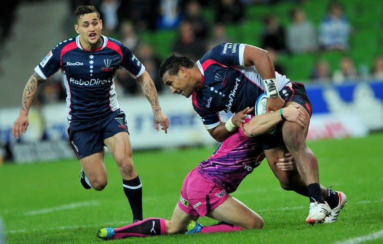 Melbourne Rebels' Cooper Vuna (R) is tackled by a Northern Bulls player during their Super 15 rugby union match in Melbourne, on May 4, 2012. The 2013 Super 15 season kicks off this weekend with two all-Australian ties as players seek to impress national selectors ahead of the looming British and Irish Lions tour Down Under. The Rebels host Western Force in their opener on Friday