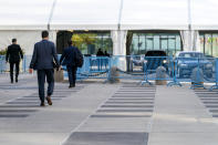 Delegates arrive at United Nations headquarters, Monday, Sept. 21, 2020, in New York. In 2020, which marks the 75th anniversary of the United Nations, the annual high-level meeting of world leaders around the U.N. General Assembly will be very different from years past because of the coronavirus pandemic. Leaders will not be traveling to the United Nations in New York for their addresses, which will be prerecorded and most events related to the gathering will be held virtually. (AP Photo/Mary Altaffer)