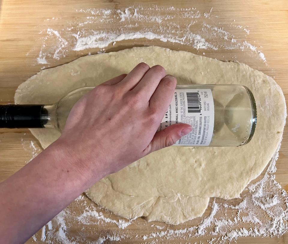 Flatten the dough using a rolling pin.