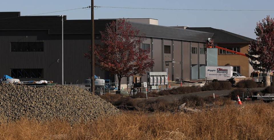 Construction workers continue their efforts on a new building being added to the campus of Calvary Chapel Tri-Cities at 10611 W. Clearwater Ave. in west Kennewick. Bob Brawdy/bbrawdy@tricityherald.com