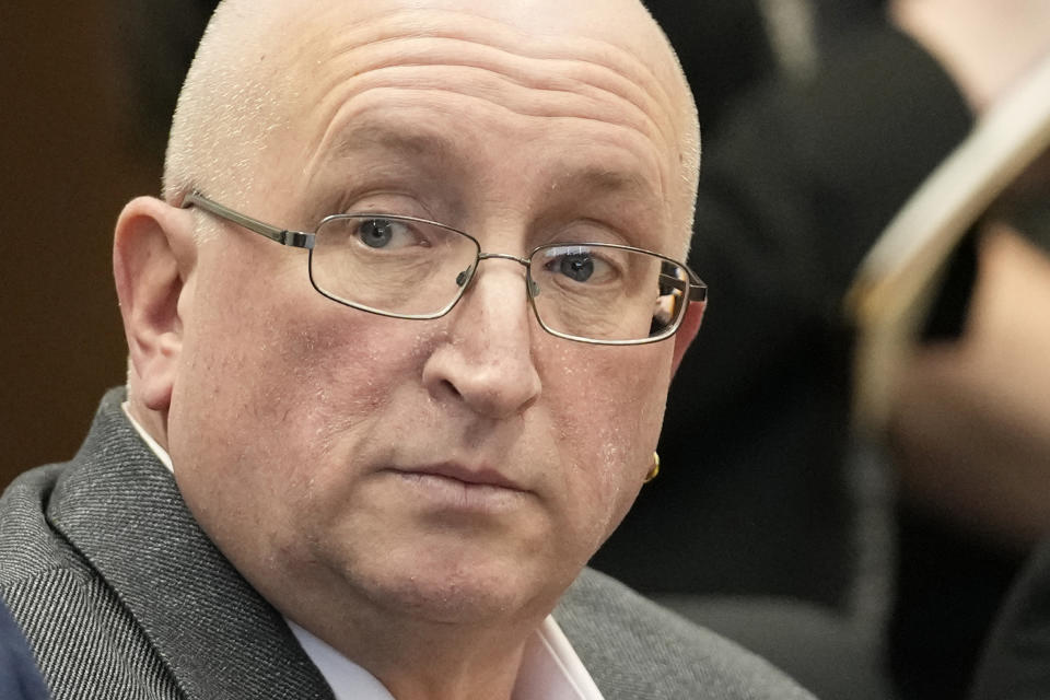 Robert E. Crimo Jr., listens during an appearance before Judge George D. Strickland at the Lake County, Ill., Courthouse Thursday, Jan. 26, 2023, in Waukegan, Ill. Crimo Jr., faces seven counts of felony reckless conduct for signing the application for his son's firearm owners ID card in December of 2019. (AP Photo/Nam Y. Huh, Pool)