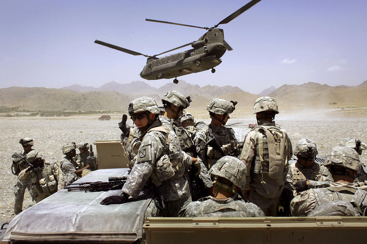 Image: American soldiers from the 10th Mountain Division leave for a base near the village of Deh Afghan in Afghanistan in 2006. (John Moore / Getty Images file)