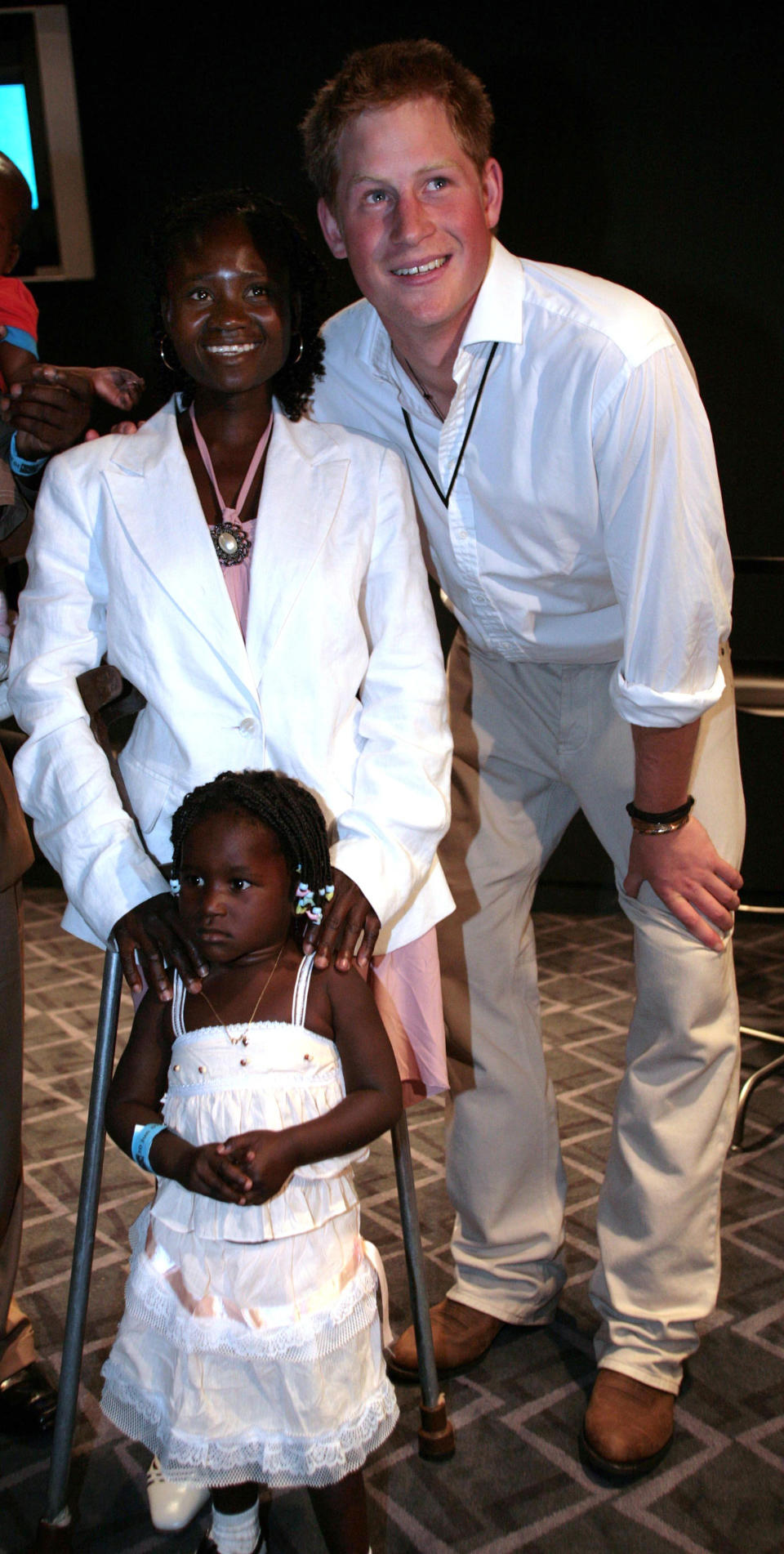 File photo dated 30/06/97 of Prince Harry standing with Eufrafina, 3 and her mother Sandra Tigica. The Duke of Sussex met Sandra Tigica again on day five of the royal tour of Africa, recalling when Princess Diana met on her visit to Angola in 1997.