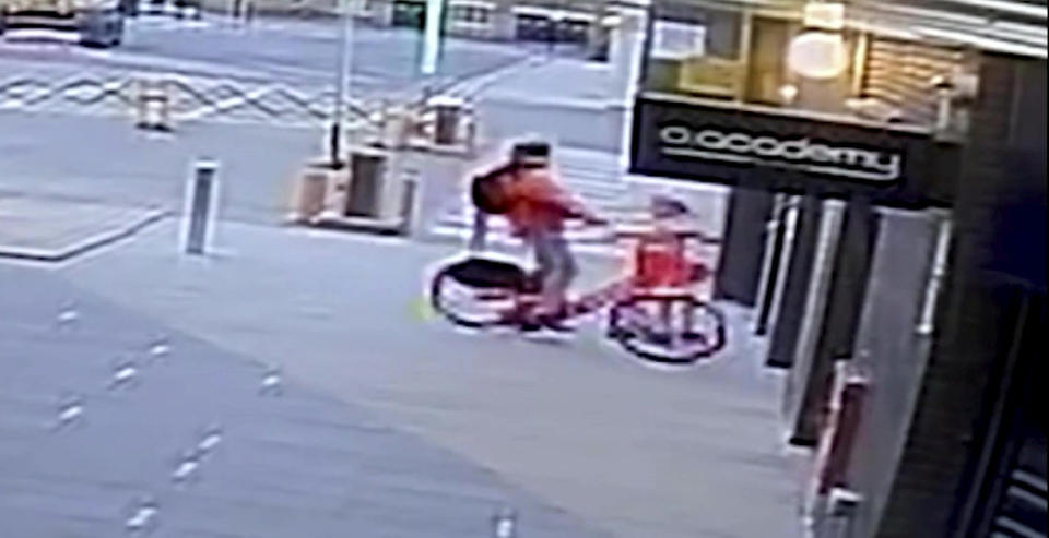 CCTV of Adam McGeady threatening and then stealing an 11-year-old girl's e-scooter. (SWNS)