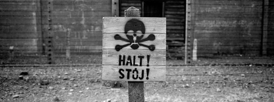 A wooden sign with the word STOP stands in front of what was an electric barbed wire fence inside the former Nazi death camp of Auschwitz I, in Oswiecim, Poland, Sunday, Dec. 8, 2019. Auschwitz was the largest of the Germans' extermination and death camps and has become a symbol for the terror of the Holocaust. On January 27, 2020 _ 75 years after its liberation _ hundreds of survivors from across the world will come back to visit Auschwitz for the official anniversary commemorations. (AP Photo/Markus Schreiber)