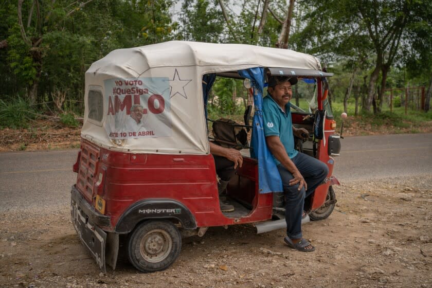 Ardelio Morales Martinez, 56, works as a cab driver driving a motorcycle taxi to take passengers to the interior of Tepetitan and surrounding towns. Ardelio placed an advertisement on his cab in favor of AMLO to remain president in the April 10 recall referendum. In Tepetitan, Tabasco, Mexico. April 9, 2022.