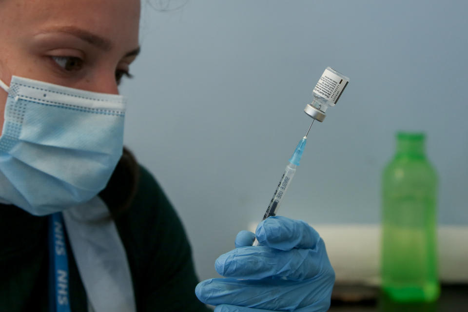 A health worker draws Pfizer Covid-19 vaccine from a vial before administering to a member of the public at a vaccination centre. (Photo by Dinendra Haria / SOPA Images/Sipa USA)