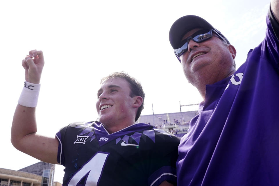 TCU quarterback Chandler Morris, left, smiles with head coach Sonny Dykes as their school song plays after an NCAA college football game against SMU, Saturday, Sept. 23, 2023, in Fort Worth, Texas. (AP Photo/LM Otero)