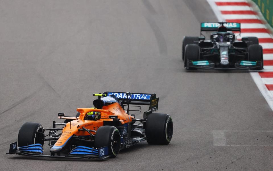 Lando Norris of Great Britain driving the (4) McLaren F1 Team MCL35M Mercedes leads Lewis Hamilton of Great Britain driving the (44) Mercedes AMG Petronas F1 Team Mercedes W12 during the F1 Grand Prix of Russia at Sochi Autodrom on September 26, 2021 in Sochi, Russia - Getty Images Europe 