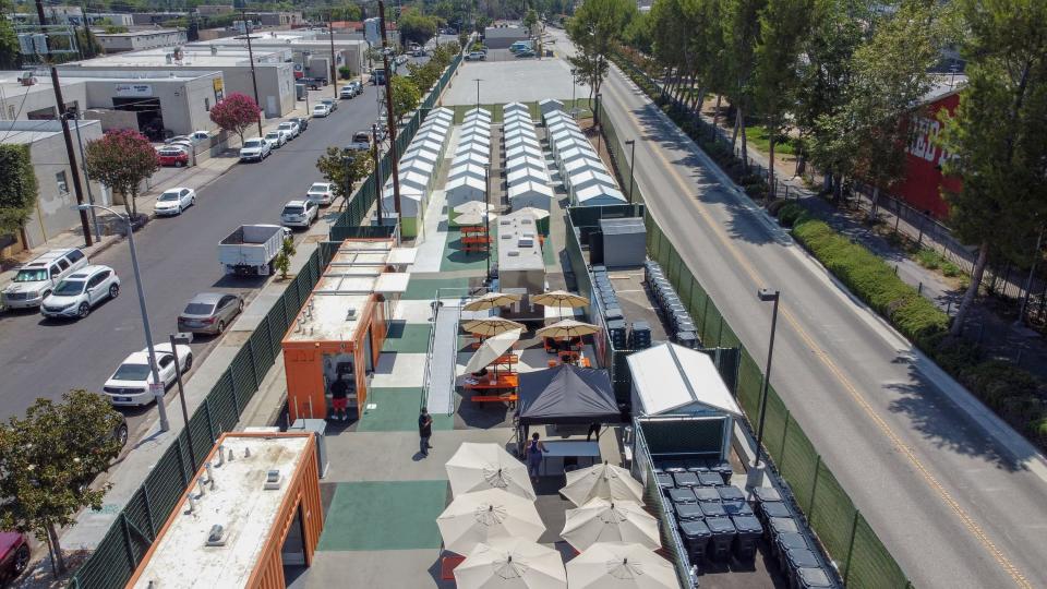 The Tarzana Tiny Home Village, a collection of very small, temporary housing units available to those experiencing homelessness, is located in a parking lot in Los Angeles.